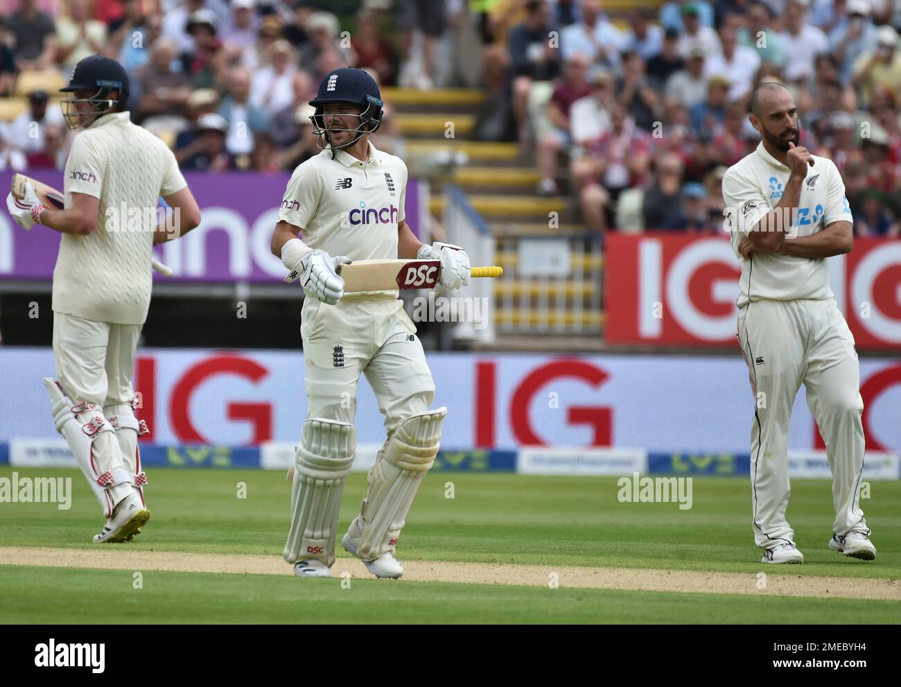 New Zealand's Daryl Mitchell, right, reacts as England's Rory Burns