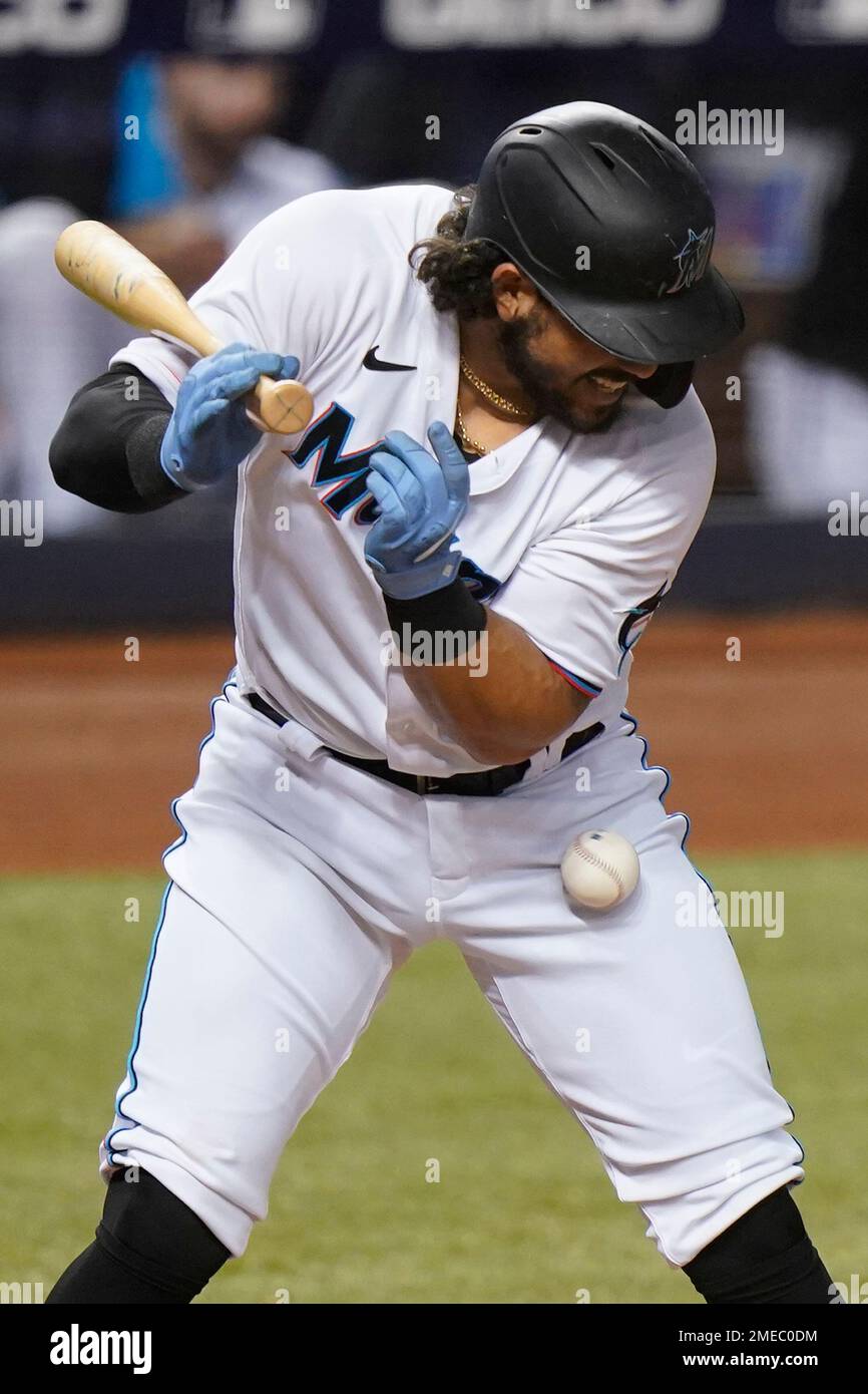 Miami Marlins' Jorge Alfaro is hit by a pitch during the ninth inning of  the team's baseball game against the Colorado Rockies, Wednesday, June 9,  2021, in Miami. (AP Photo/Wilfredo Lee Stock
