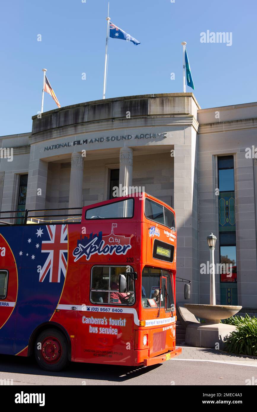 Australia's National Film and Sound archive with tourist bus passing. Stock Photo