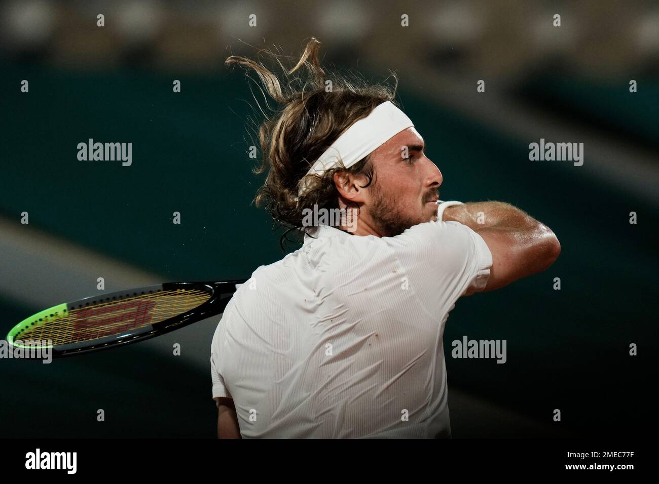 Stefanos Tsitsipas of Greece slams a forehand to Russias Daniil Medvedev during their quarterfinal match of the French Open tennis tournament at the Roland Garros stadium Tuesday, June 8, 2021 in Paris
