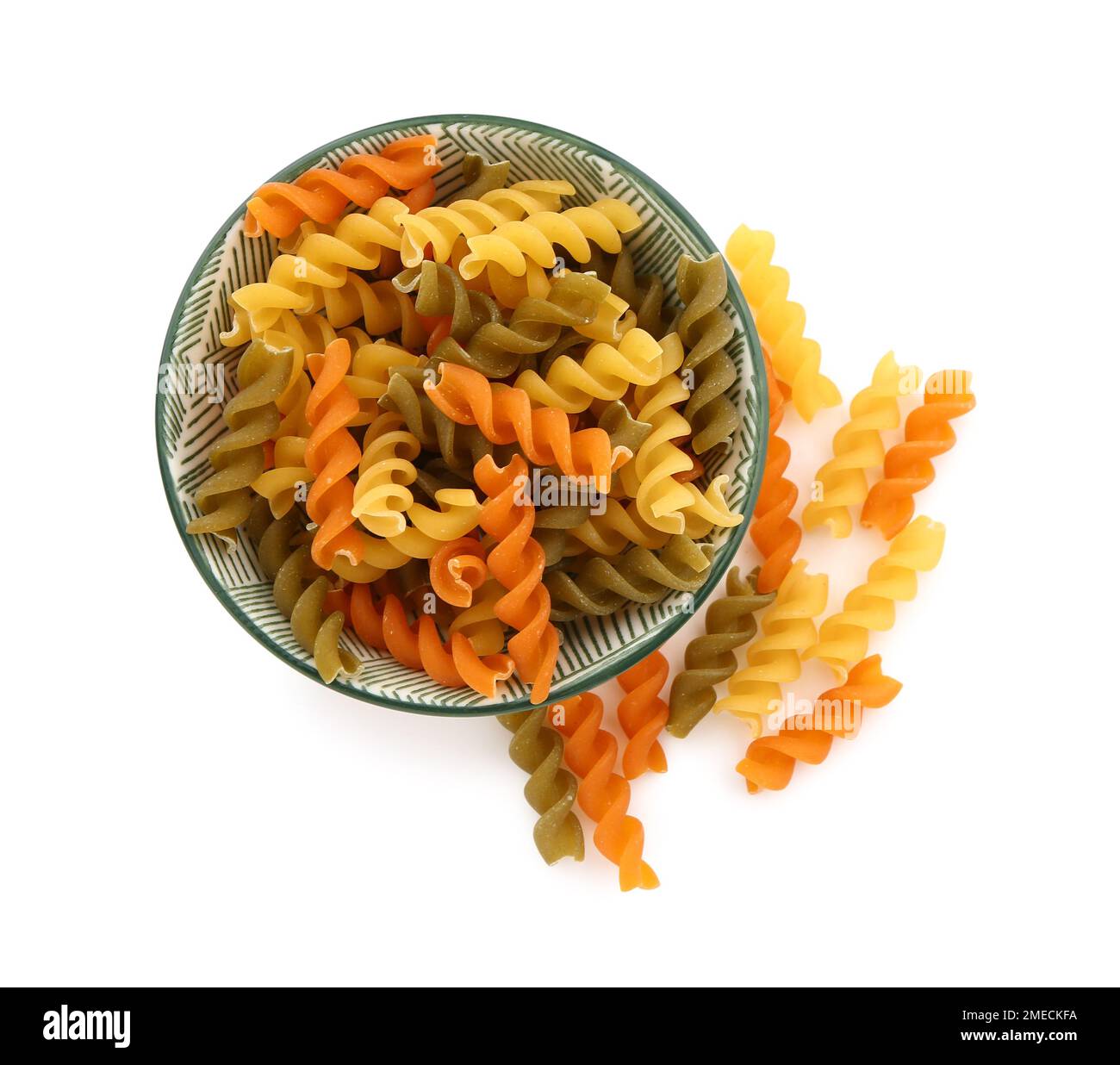 Bowl of raw fusilli pasta on white background Stock Photo Alamy