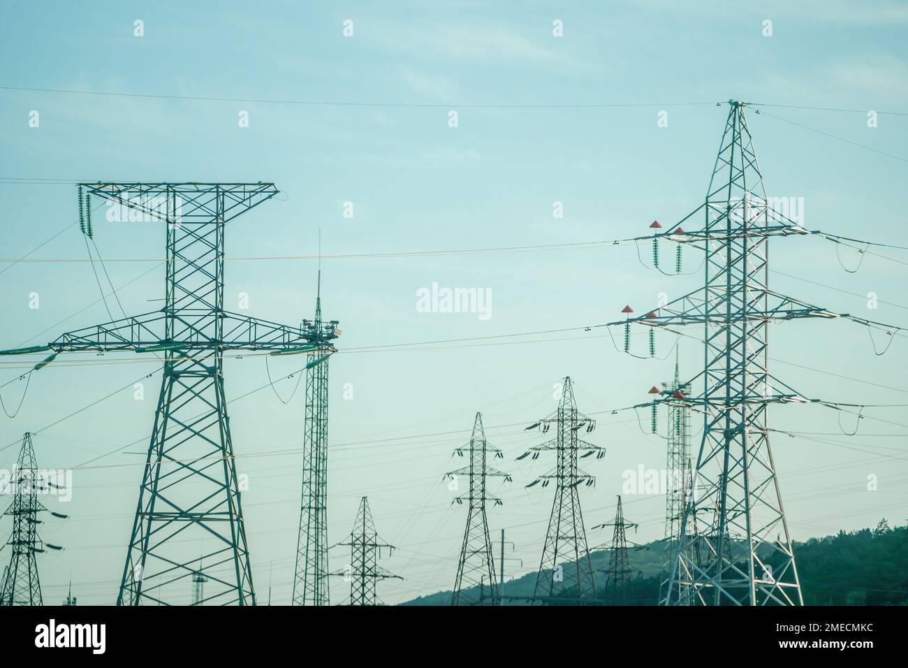 Power line support with wires for electricity transmission. Silhouette High voltage grid tower