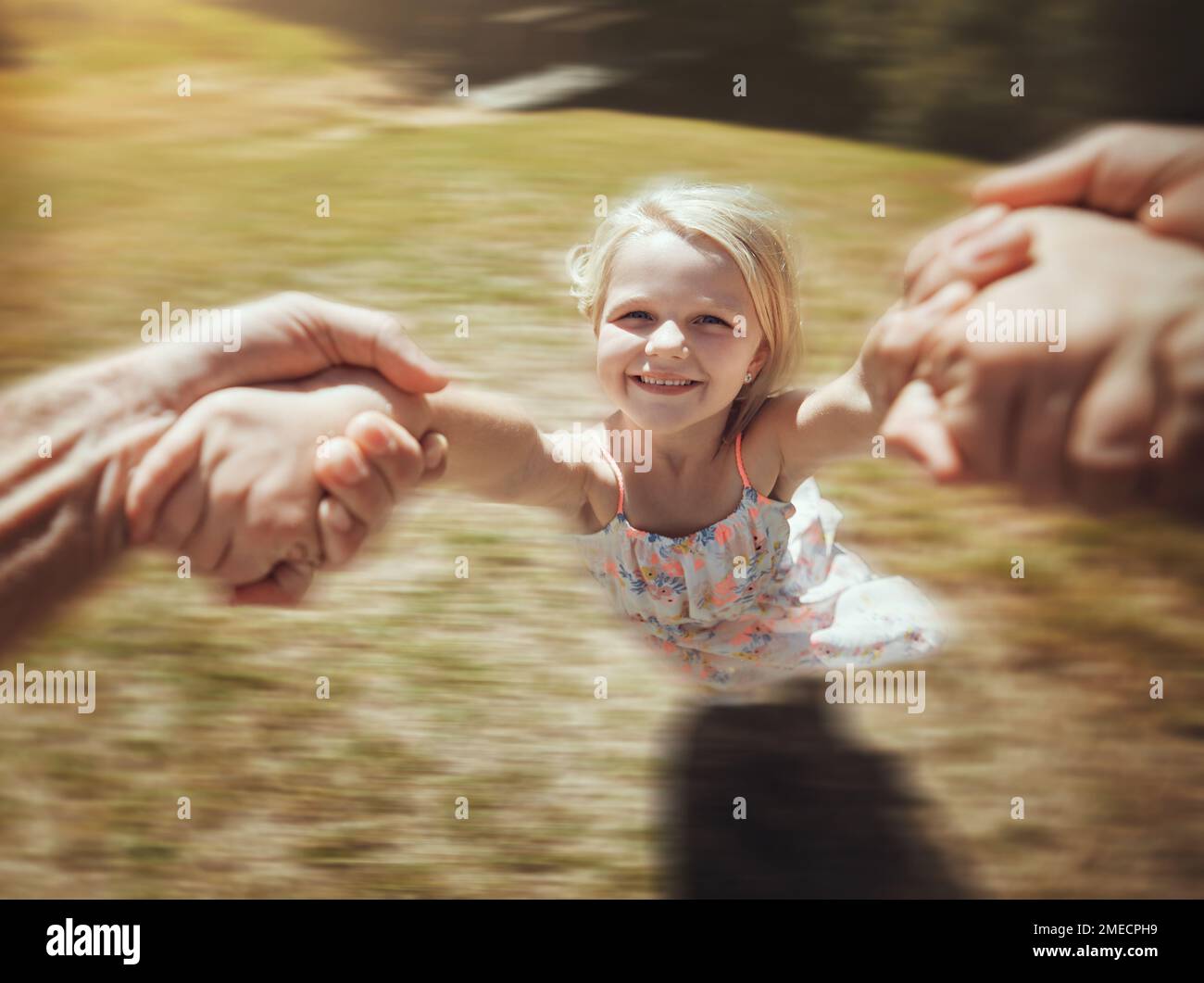 Child portrait, hands or spinning fun game in nature park, home garden or house backyard in trust, support or energy. Smile, bonding or father Stock Photo