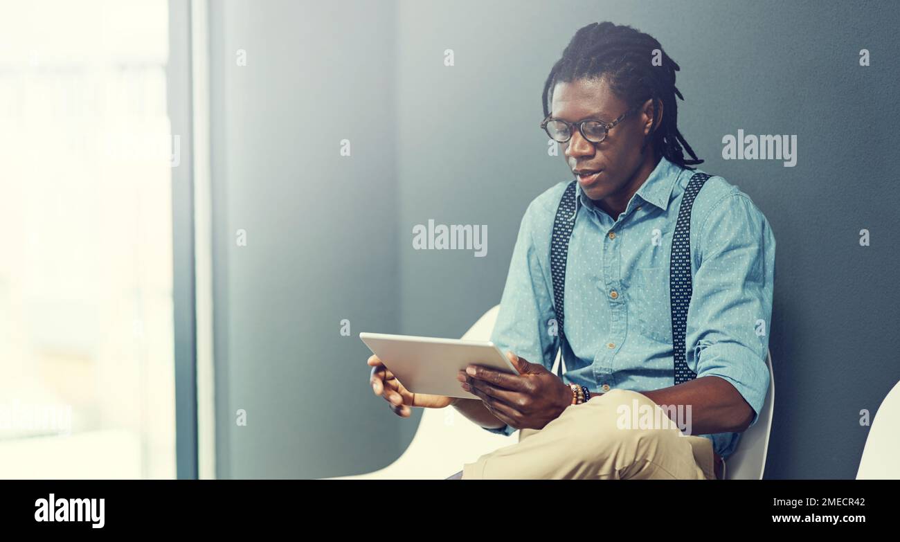 Tips for the interview at my fingertips. a young businessman using a ...