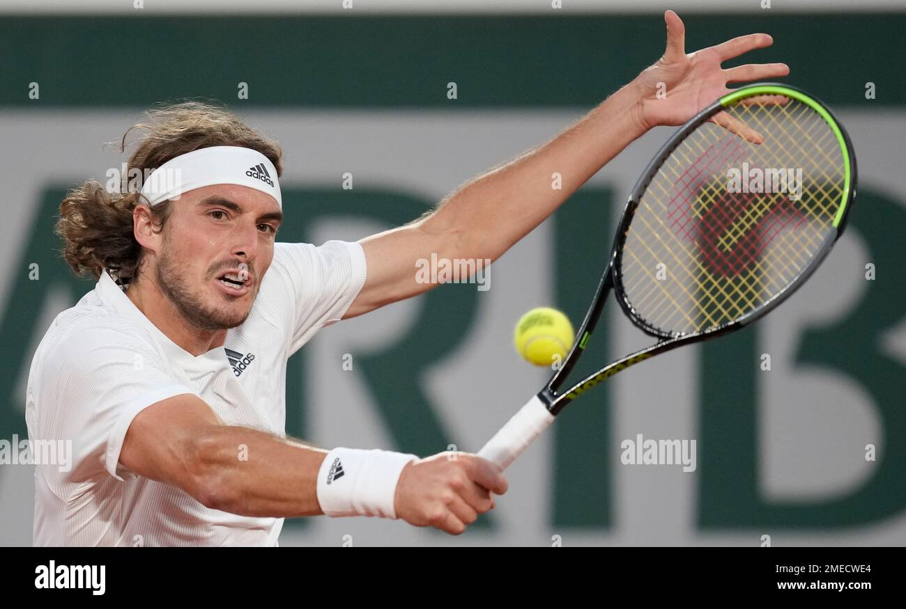 Stefanos Tsitsipas of Greece plays a return to United States John Isner during their third round match on day 6, of the French Open tennis tournament at Roland Garros in Paris, France,