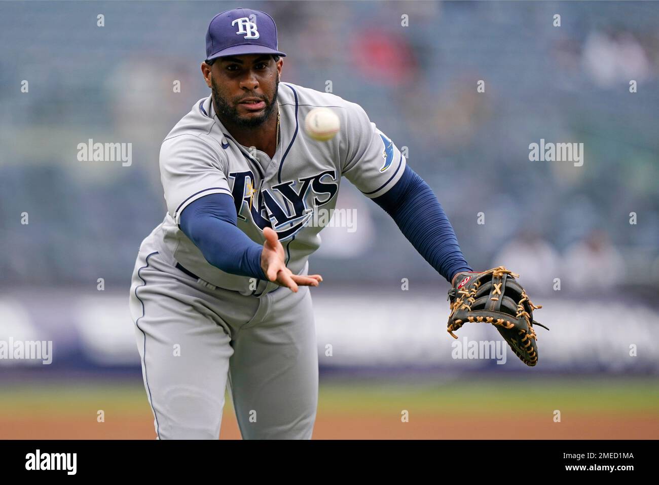 Tampa Bay Rays first baseman Yandy Diaz (2) throws to first to put out a runner during the first