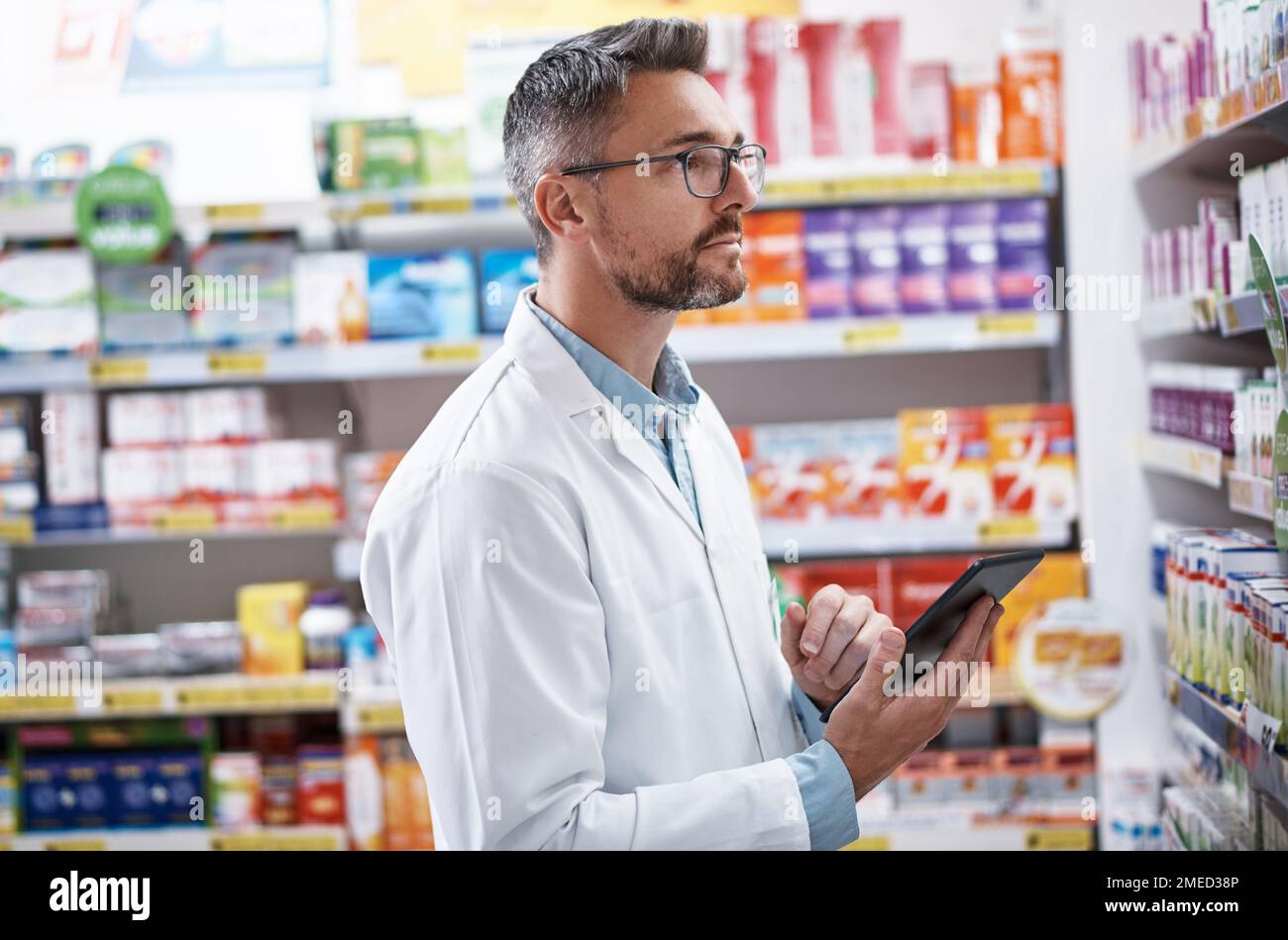 Dispensing the best medicine is what he does best. a mature pharmacist