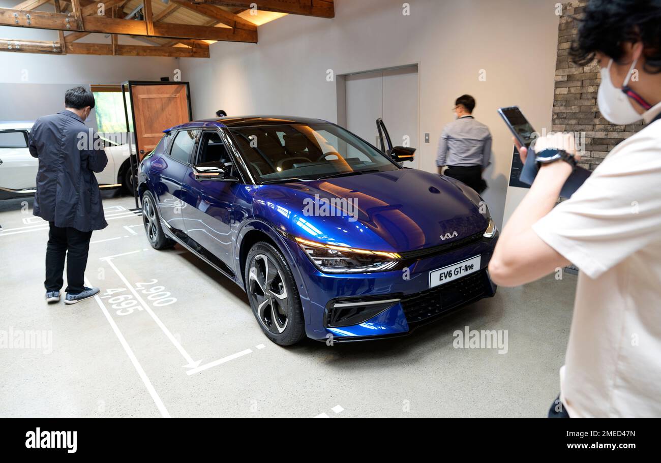Visitors look at Kia Corp's new electric vehicle EV6 GTline during its