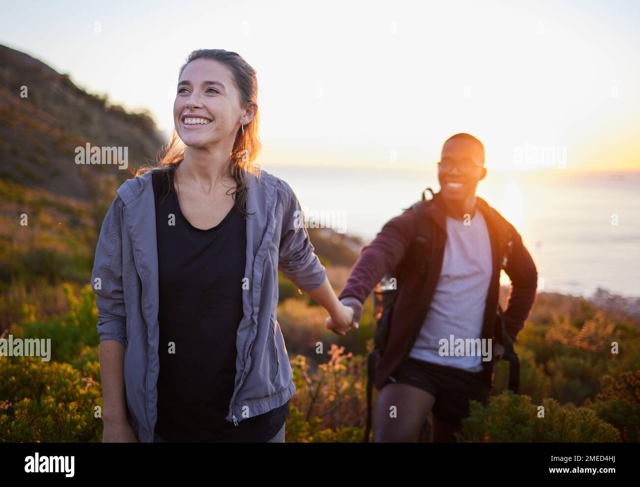 Happy man woman hiking mountains hi-res stock photography and images ...