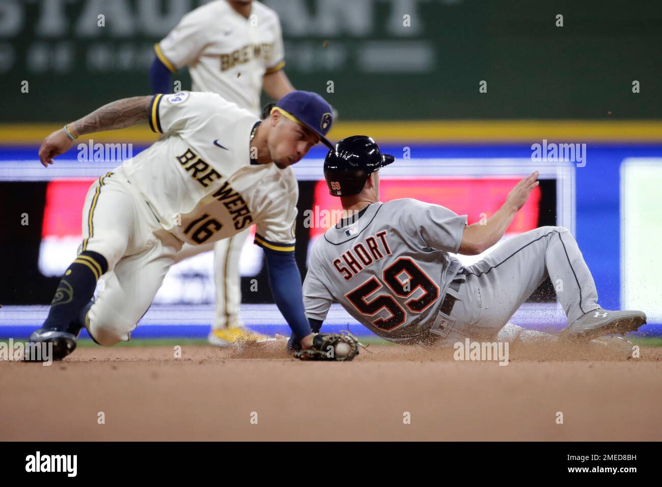 Zack Short (59) second base past the tag of Milwaukee Brewers' Kolten Wong