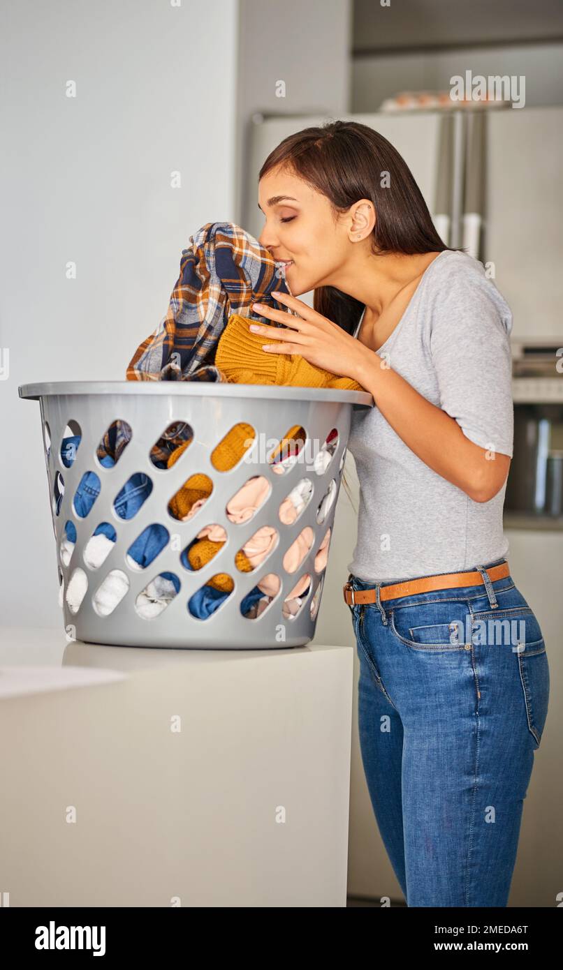 They smell so super fresh. an attractive young woman smelling clean