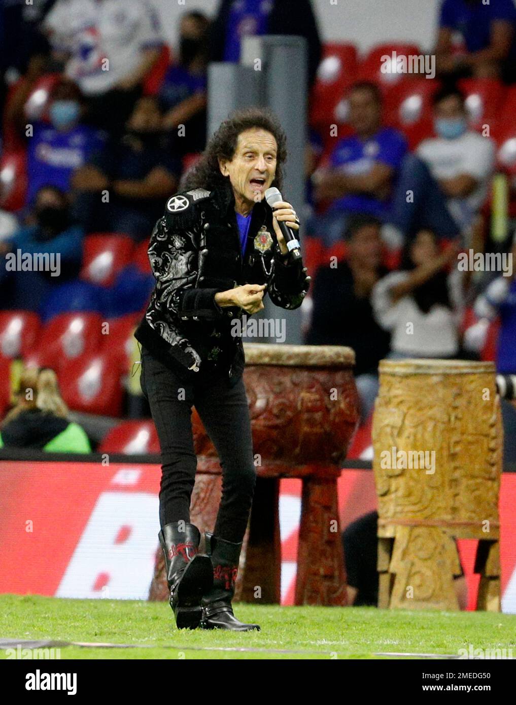 Mexican singer Alex Lora, of the band El Tri performs at the half
