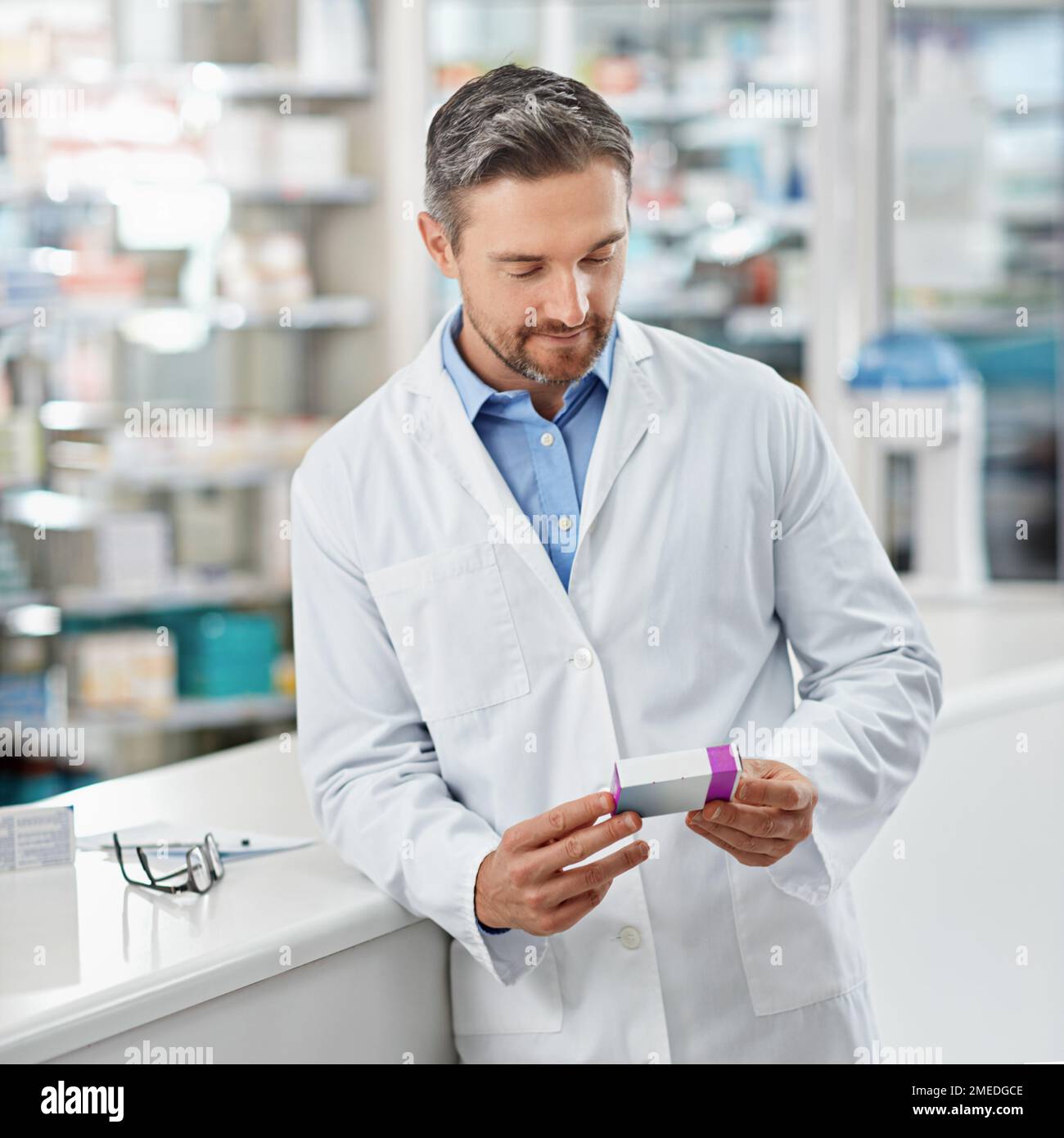 Pharmacy, inventory and pharmacist man with medicine, stock supplier check and healthcare industry. Product, tablet box or medical pills of retail Stock Photo