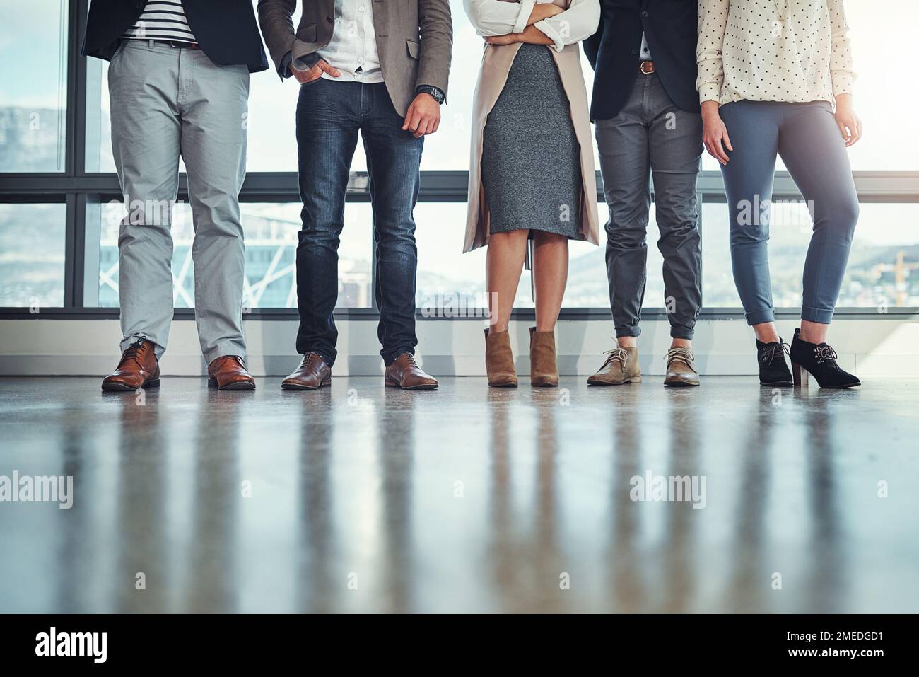 Ready for the business day. a group of unrecognizable businesspeople