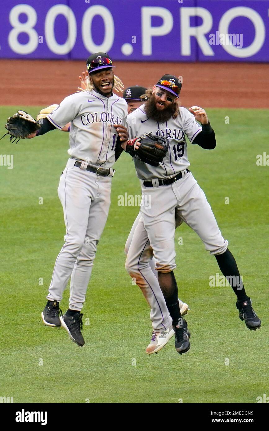 Colorado Rockies outfielders Raimel Tapia, left, Yonathan Daza, rear
