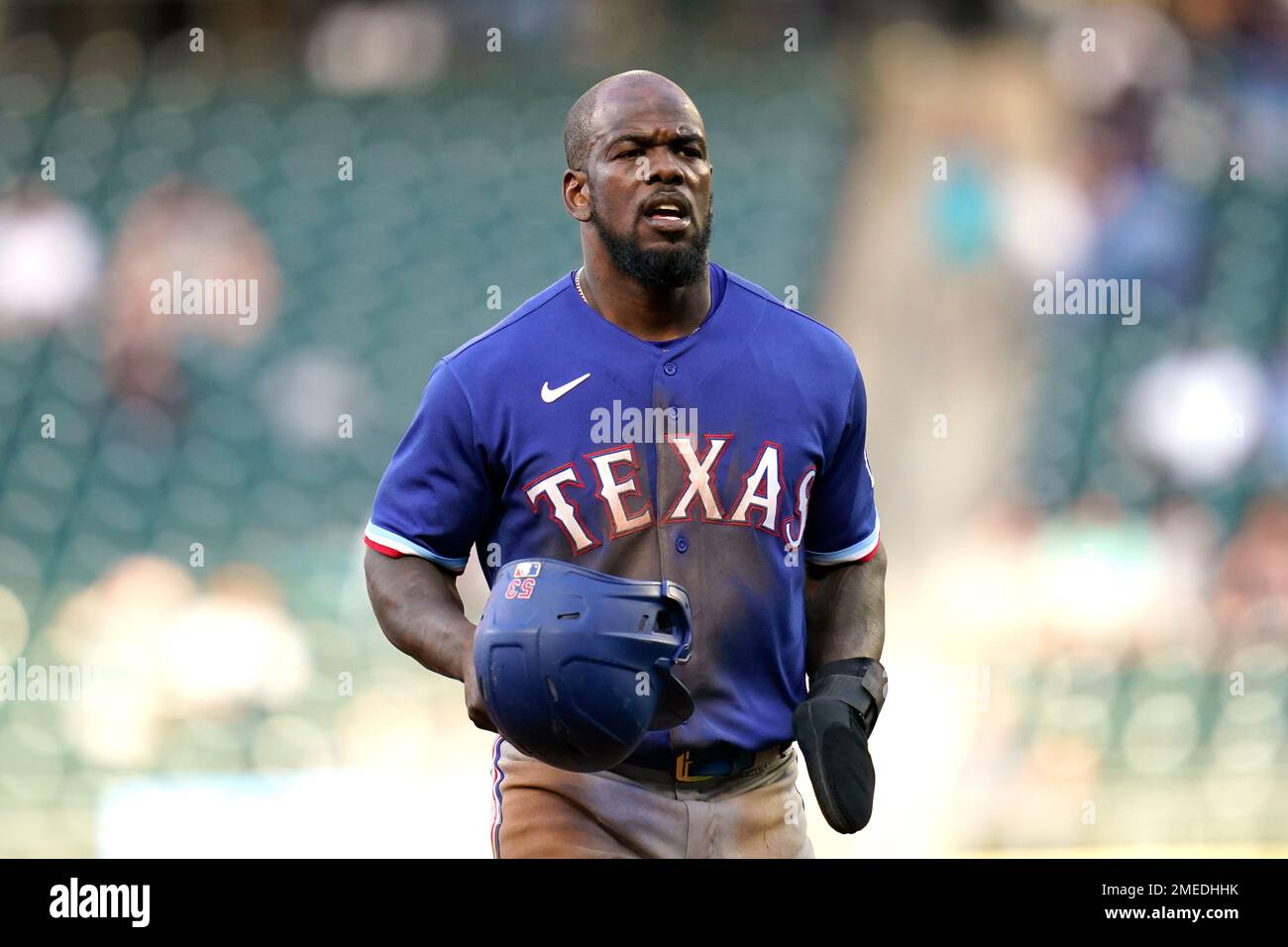 Texas Rangers' Adolis Garcia heads to first after drawing a walk against  the Seattle Mariners during the seventh inning of a baseball game Thursday,  May 27, 2021, in Seattle. (AP Photo/Elaine Thompson