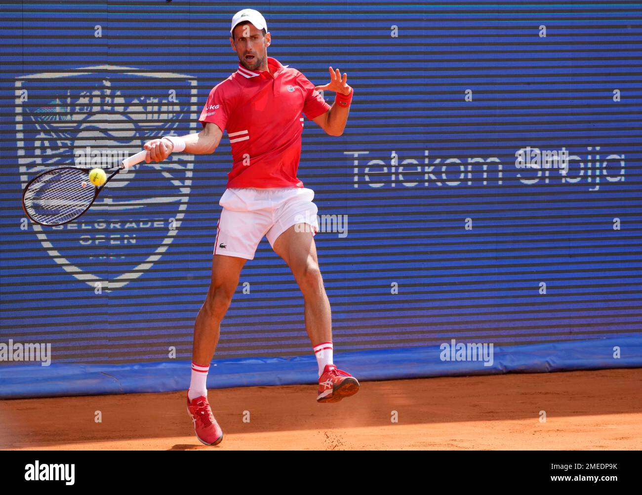 Novak Djokovic of Serbia returns a ball to Alex Molcan of Slovakia during their final tennis match of the Belgrade Open tennis tournament in Belgrade, Serbia, Saturday, May 29, 2021