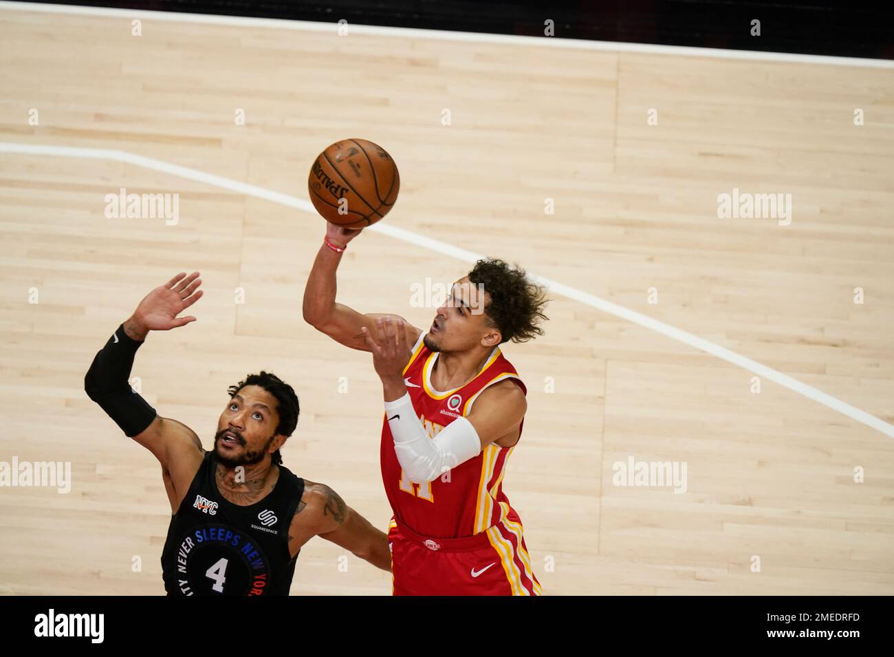 Atlanta Hawks' Trae Young (11) shoots against New York Knicks' Derrick Rose (4) during the first half in Game 3 of an NBA basketball first-round playoff series Friday, May 28, 2021, in Atlanta. (AP Photo/Brynn Anderson) Stock Photo