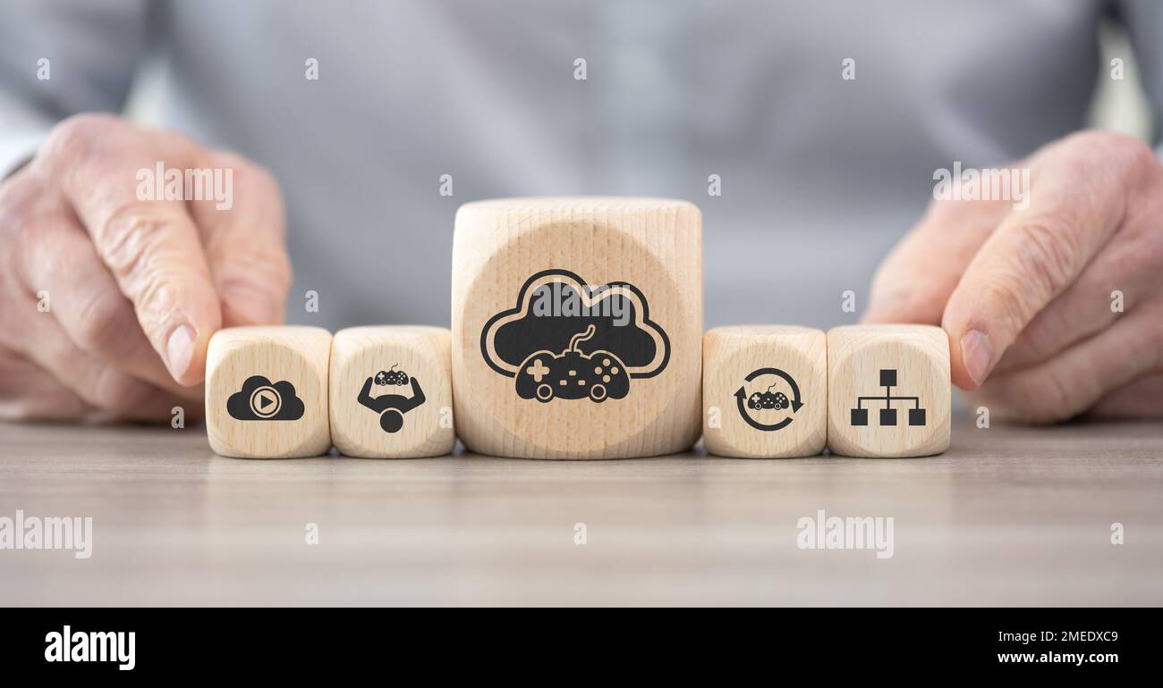 Wooden blocks with symbol of cloud gaming concept Stock Photo