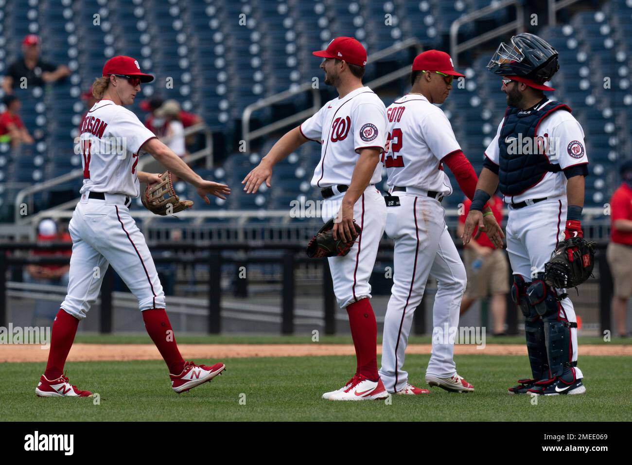 From left, Washington Nationals center fielder Andrew Stevenson, relief pitcher Brad Hand, left