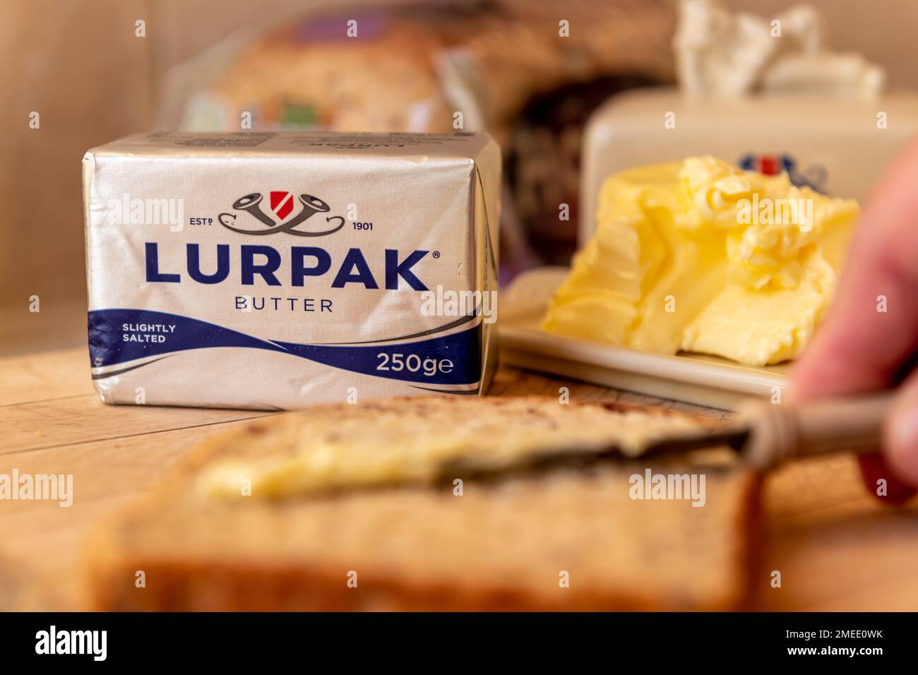 London. UK- 01.22.2023. Lurkak butter on a wooden board in the kitchen. Stock Photo