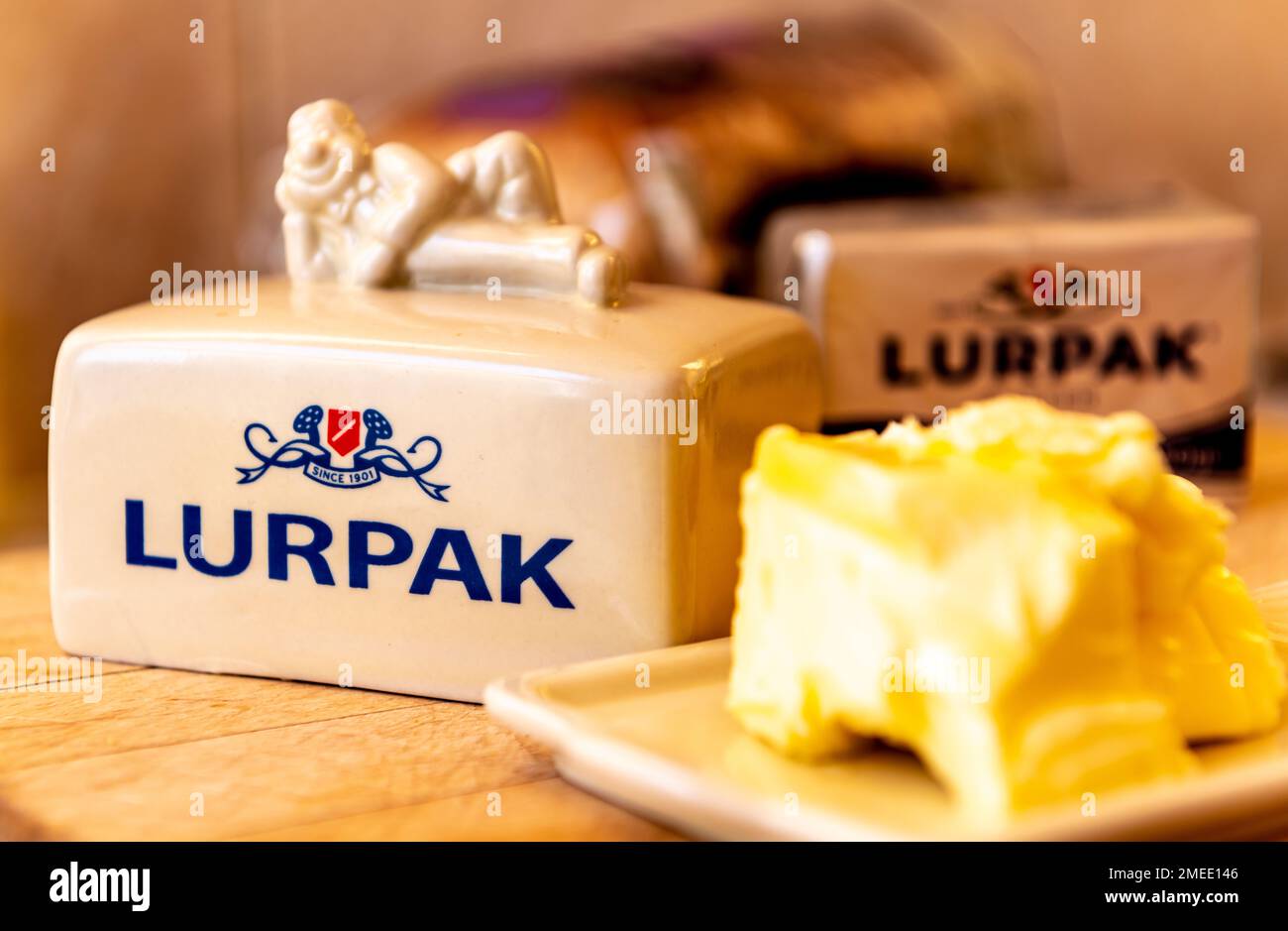 London. UK- 01.22.2023. Lurkak butter on a wooden board in the kitchen. Stock Photo