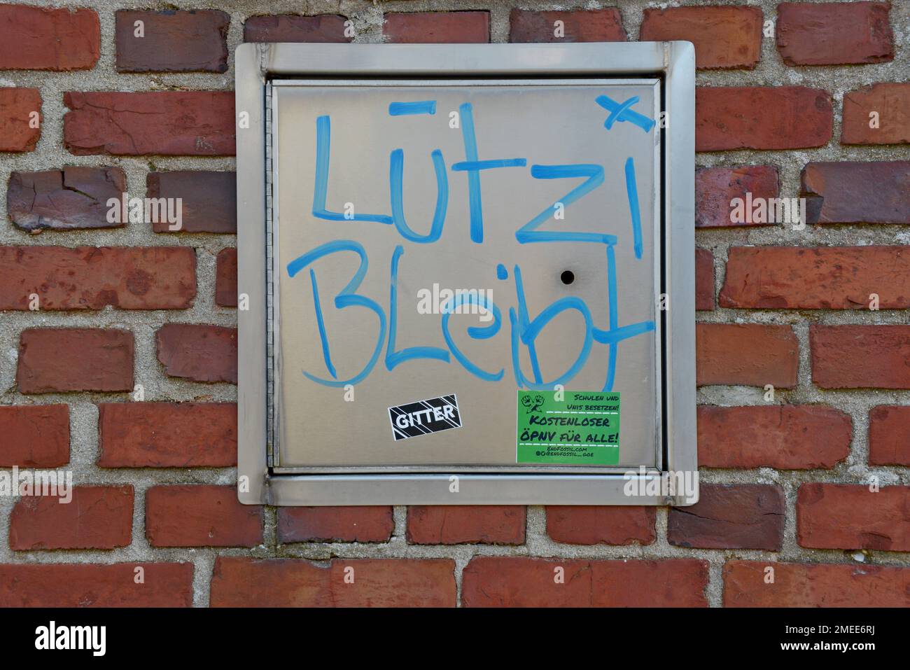 Protest graffiti Lutzi Bleibt (Lutzi stays) in Keyenberg, Germany, near Garzweiler II open cast lignite  coal mine, site of climate change protests Stock Photo