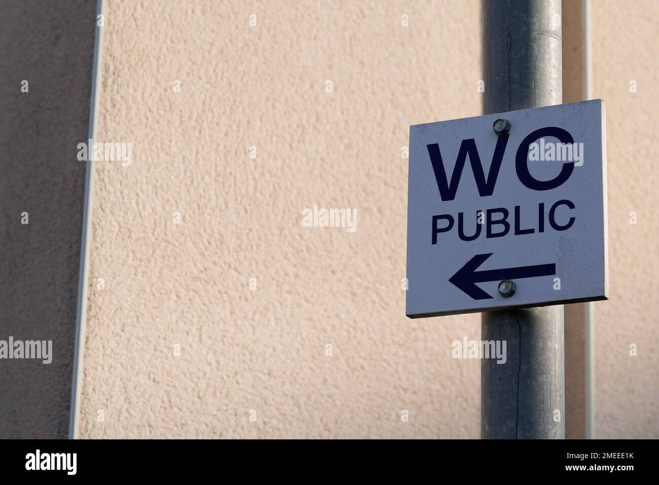 wc arrow street text means Toilets public restroom sign panel access