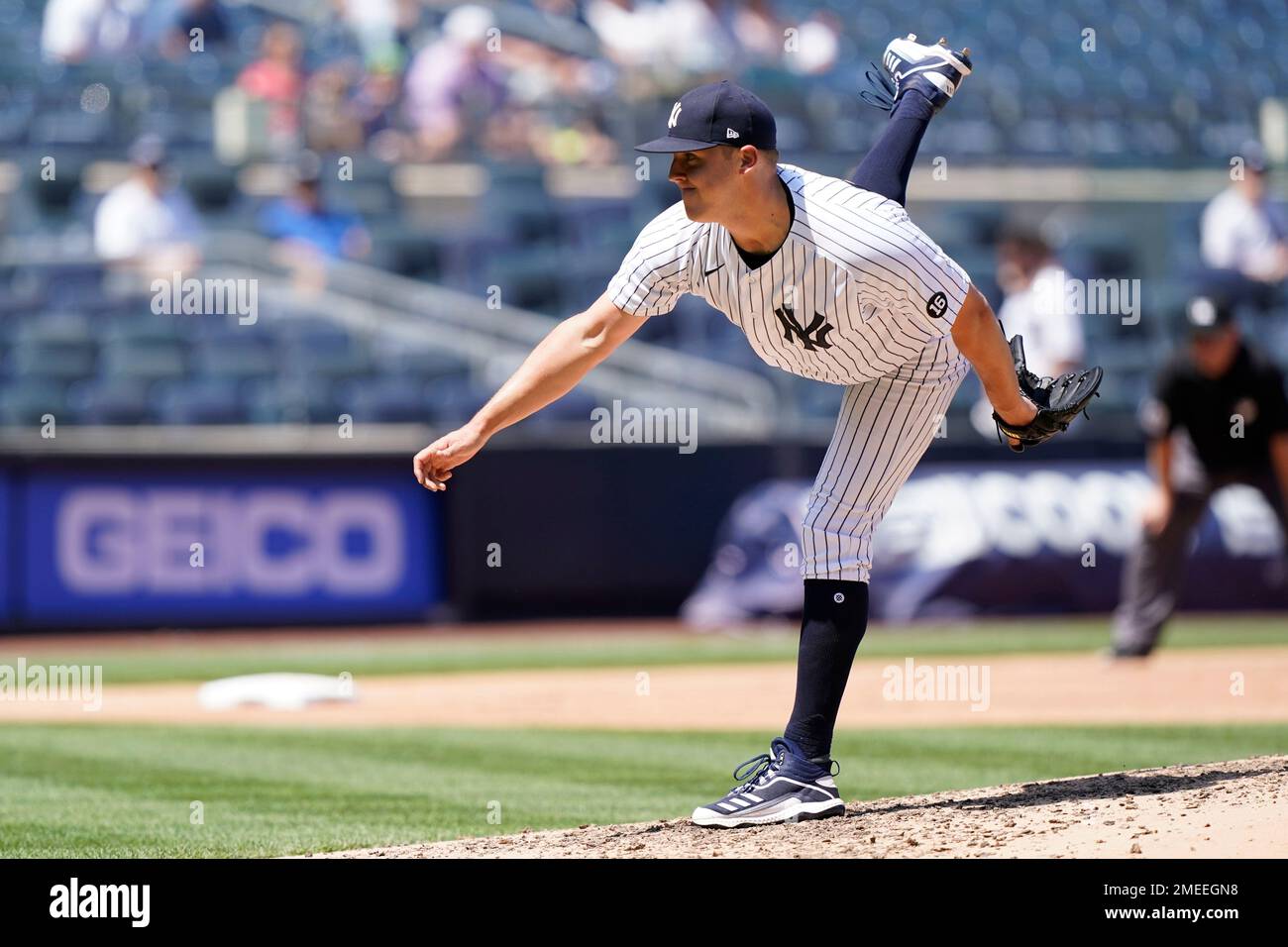 New York Yankees starting pitcher Jameson Taillon (50) follows through