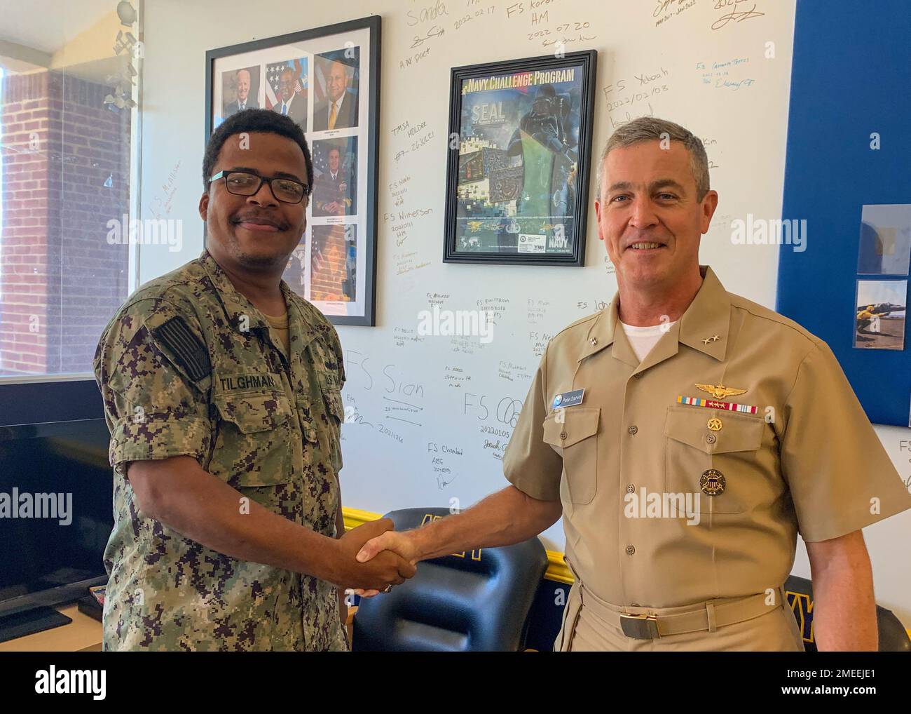 220816-N-N0443-1003 WOODBRIDGE, Va. (Aug. 16, 2022) Fire Controlman 2nd Class Marvin Tilghman, left, poses for a photo with Rear Adm. Pete Garvin, commander, Naval Education and Training Command (NETC), at Navy Recruiting Station Woodbridge, Virginia, Aug. 16, 2022.  Garvin visited the recruiting station to talk with recruiters about their mission to inform, attract, influence and hire the highest quality candidates from America's diverse talent pool. As the owner of the Force Development pillar within MyNavy HR, NETC recruits, trains and delivers those who serve the nation, taking them from ' Stock Photo