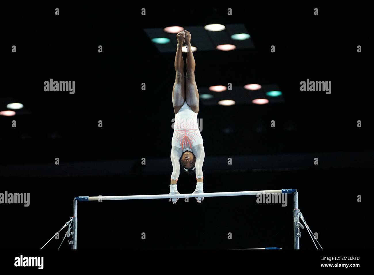 Simone Biles performs her routine on the uneven bars during the U.S