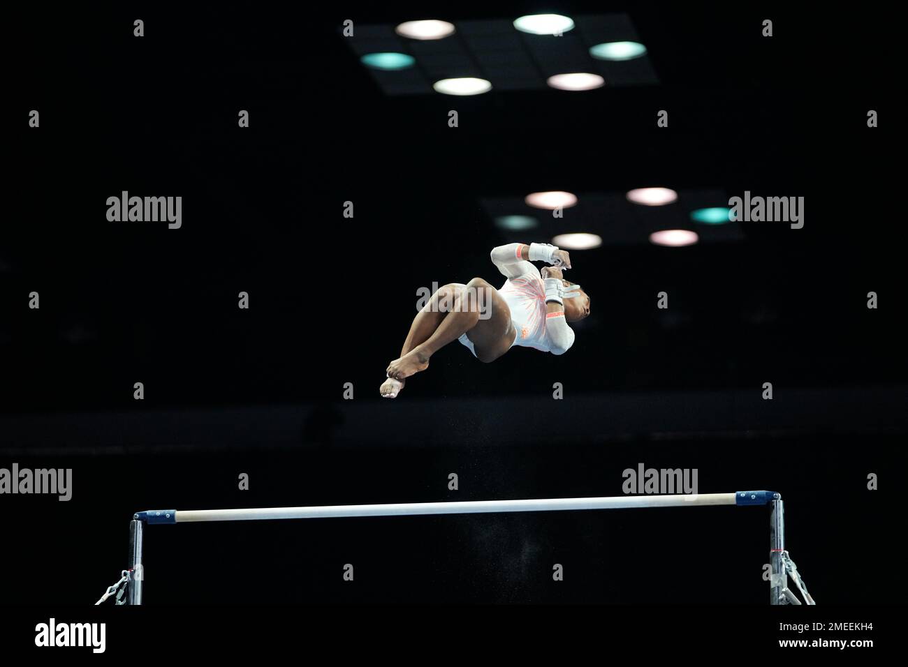 Simone Biles performs her routine on the uneven bars during the U.S