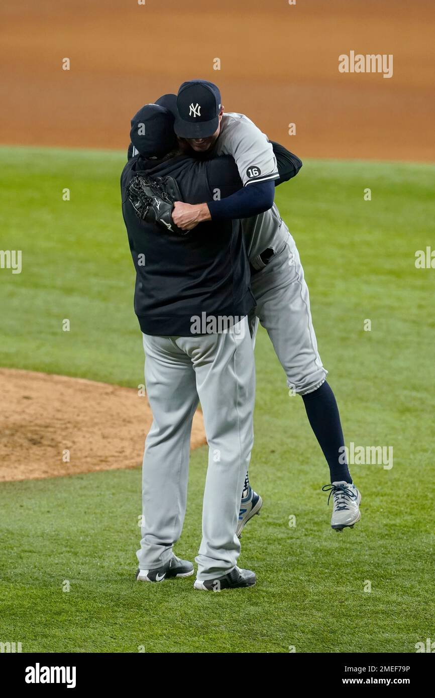 New York Yankees pitching coach Matt Blake lifts starting pitcher Corey