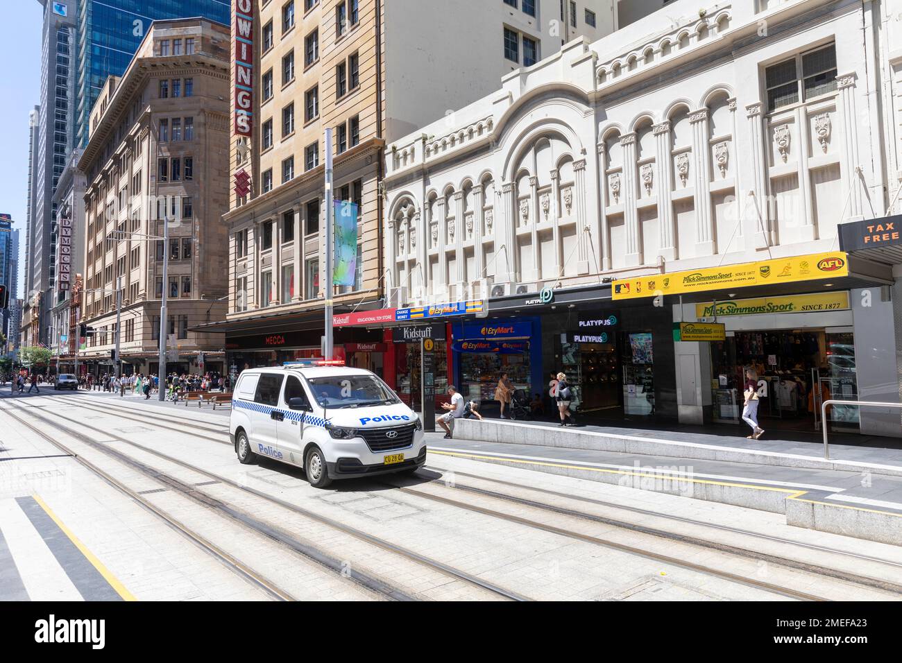 NSW Police vehicle driving along George street Sydney city centre along the light rail tracks to respond to an emergency,Sydney,Australia Stock Photo
