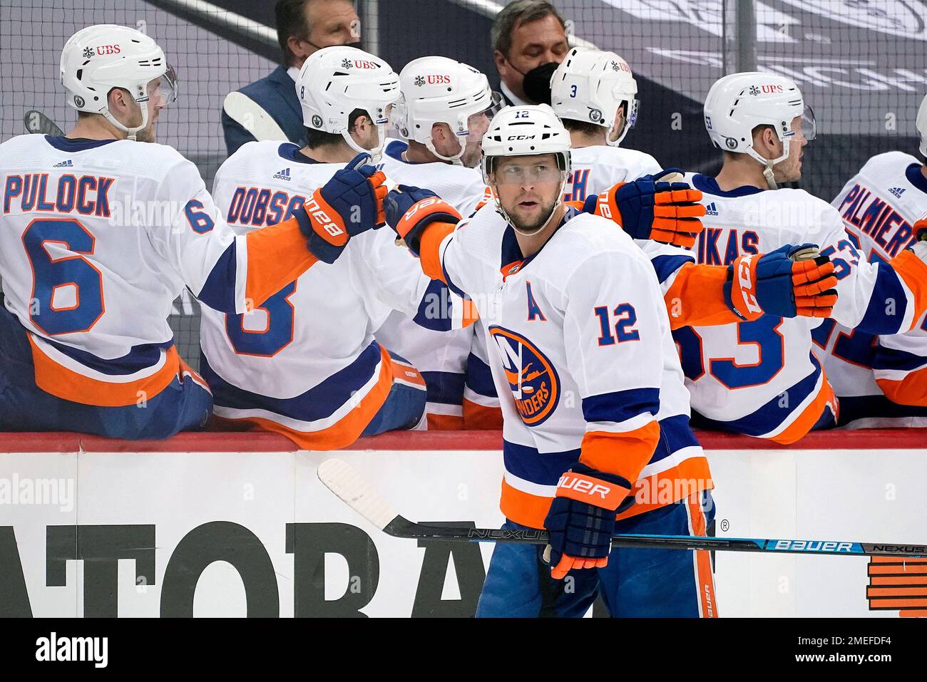 New York Islanders right wing Josh Bailey (12) skates by the bench after  scoring a goal Pittsburgh Penguins during the third period of Game 2 of an  NHL hockey first-round playoff series