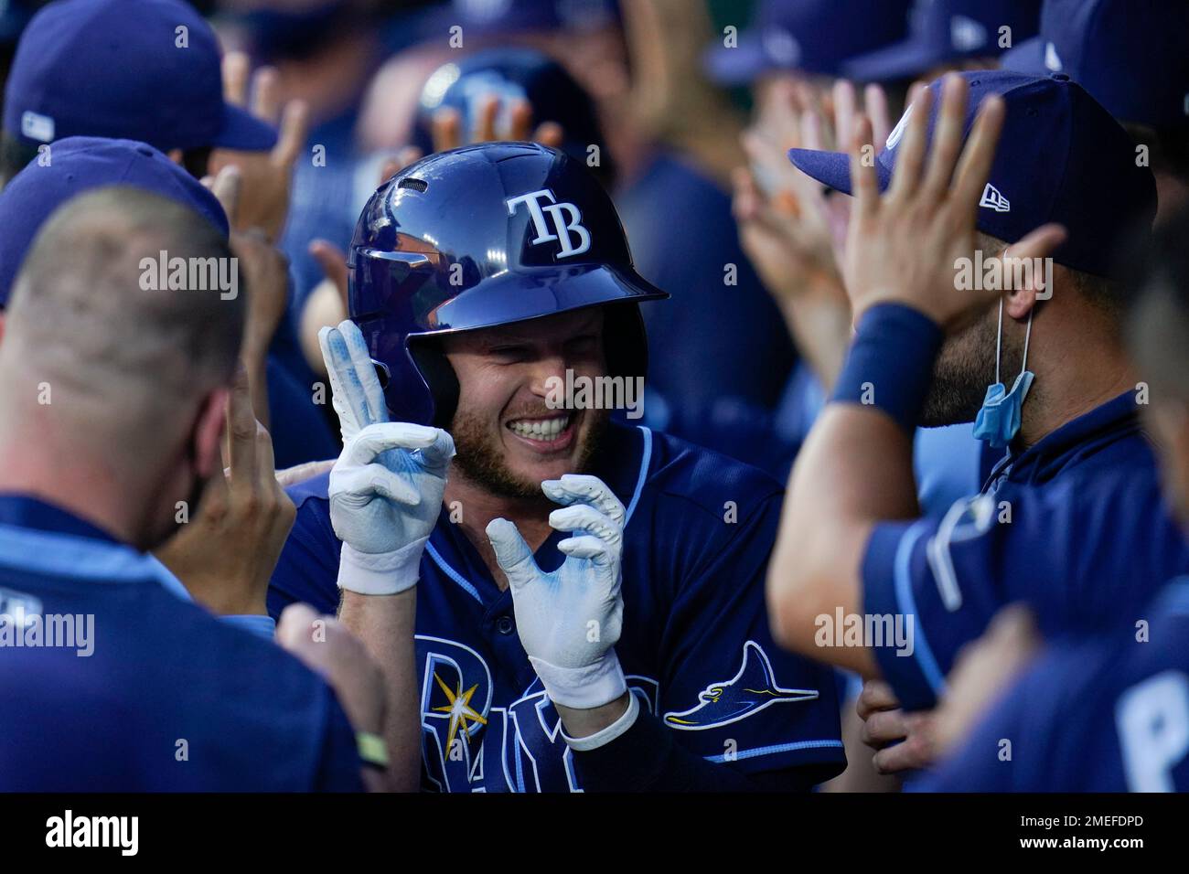 Tampa Bay Rays' Brett Phillips is greeted in the dugout after hutting a  three-run home run off Baltimore Orioles starting pitcher Matt Harvey  during the second inning of a baseball game, Tuesday