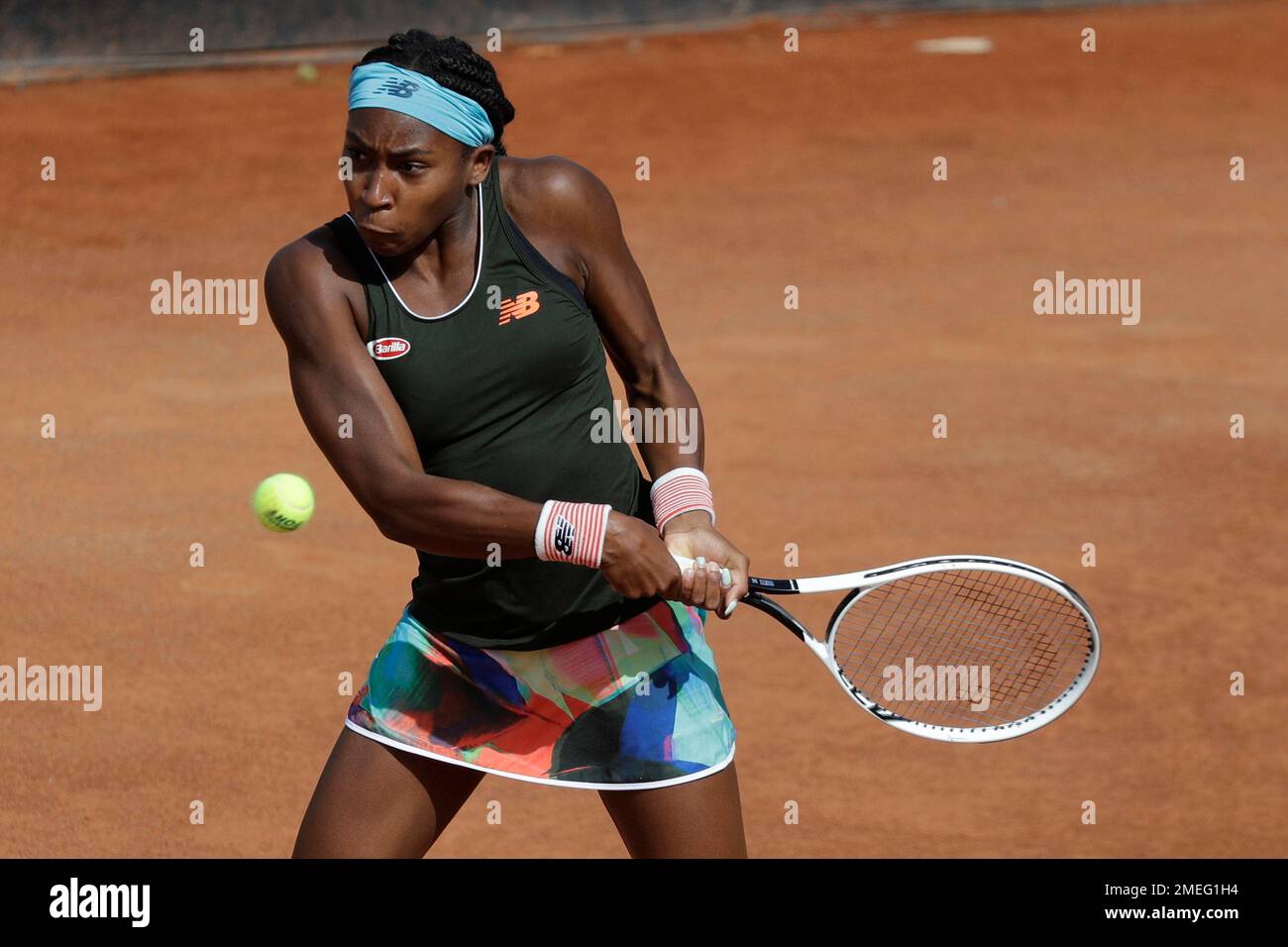 Cori Gauff, of the United States, returns the ball to Polands Iga Swiatek during their semi-final match at the Italian Open tennis tournament, in Rome, Saturday, May 15, 2021