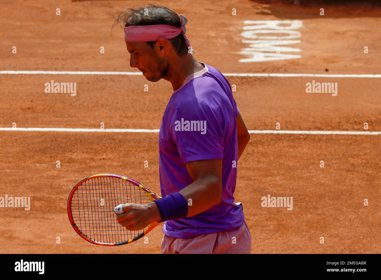 Spains Rafael Nadal looks down as he plays Canadas Denis Shapovalov, during their 3rd round match at the Italian Open tennis tournament, in Rome, Thursday, May 13, 2021