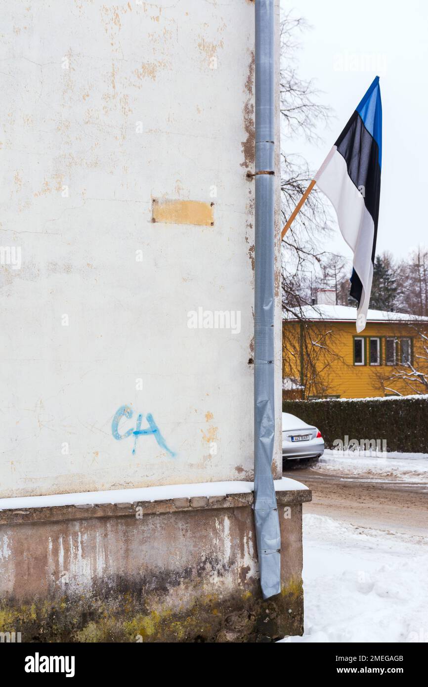 Estonian flag hanging from wall in street corner in Viljandi Estonia Stock Photo