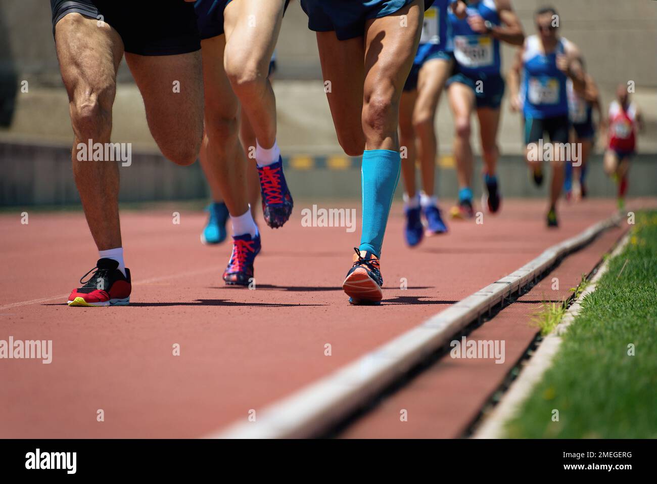 Athletics people running on the track field Stock Photo Alamy