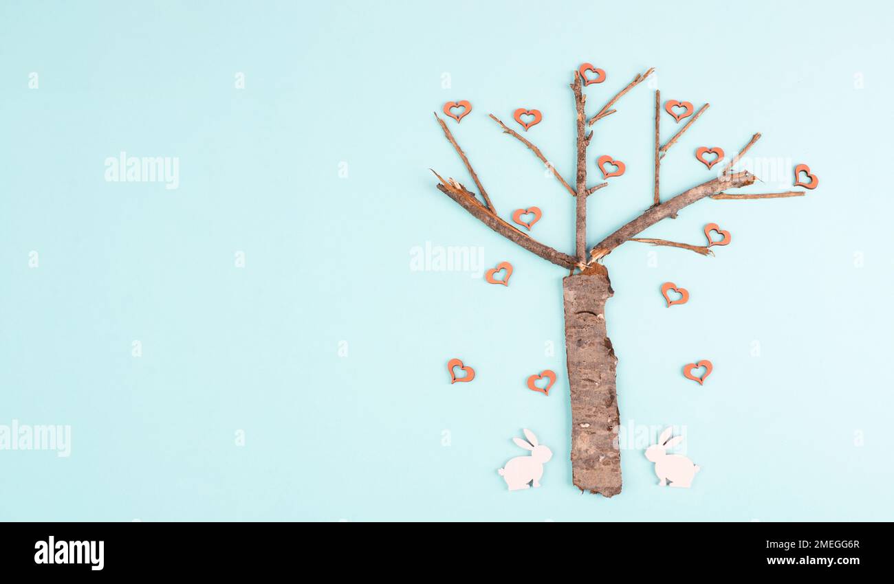 Easter card rabbits tree hi-res stock photography and images - Alamy