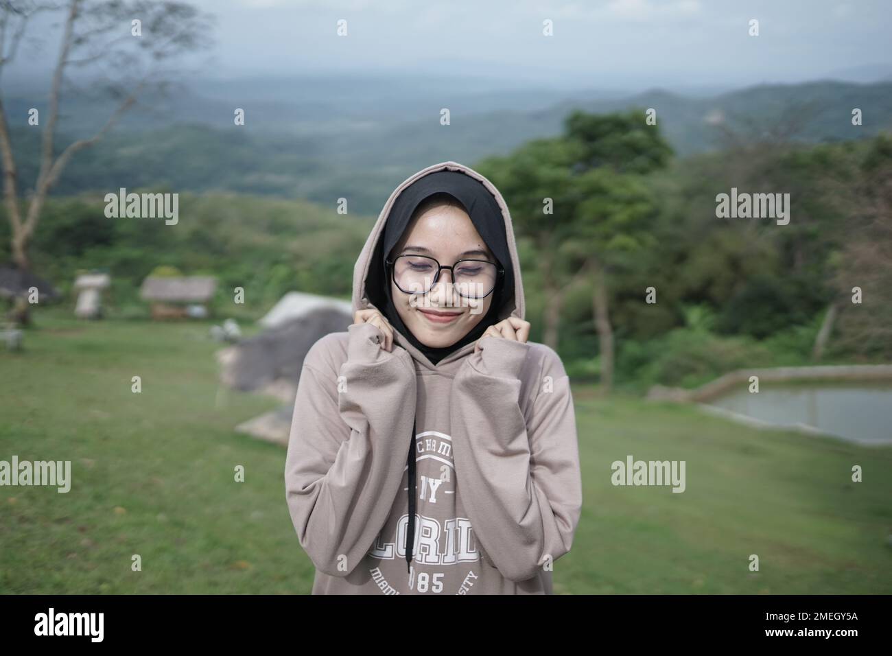 beautiful girl wearing e jacket in the forest Stock Photo - Alamy