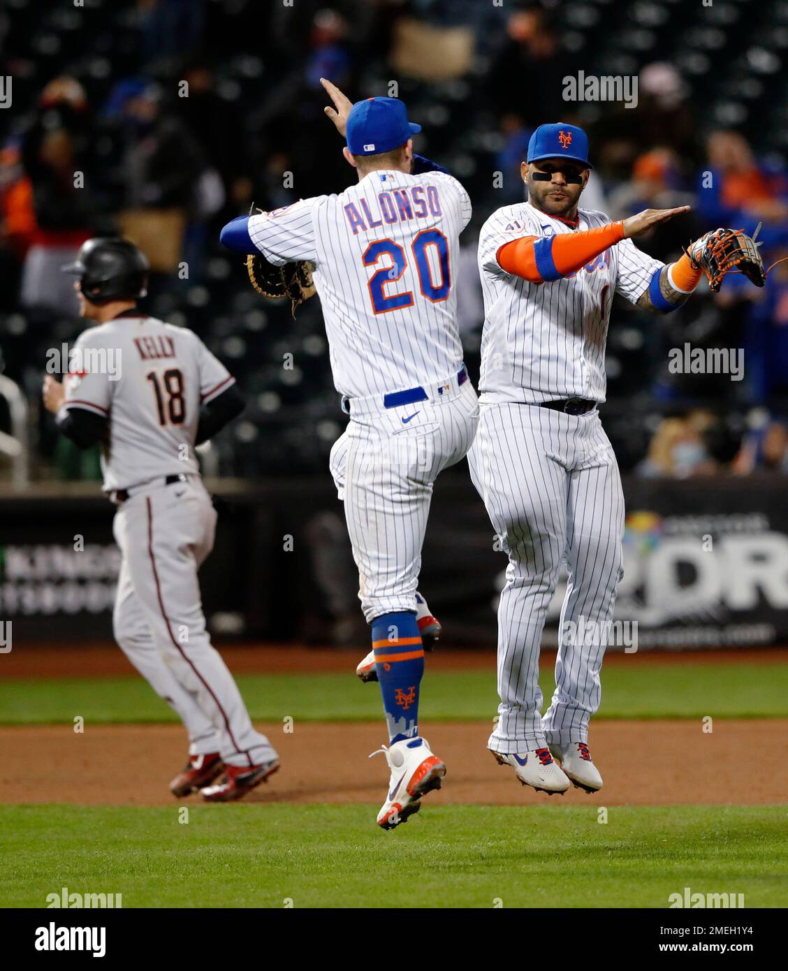 New York Mets' Pete Alonso (20) and Jonathan Villar (1) celebrate after