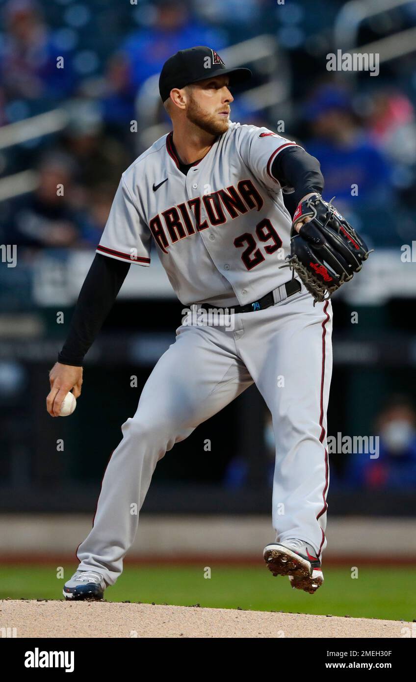 Arizona Diamondbacks starting pitcher Merril Kelly winds up during the