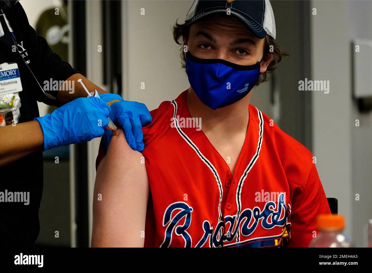 Williams Hughes, of Savannah, Ga., gets a COVID-19 vaccine before a baseball game between the Atlanta Braves and the Philadelphia Phillies, Friday, May 7, 2021, in Atlanta