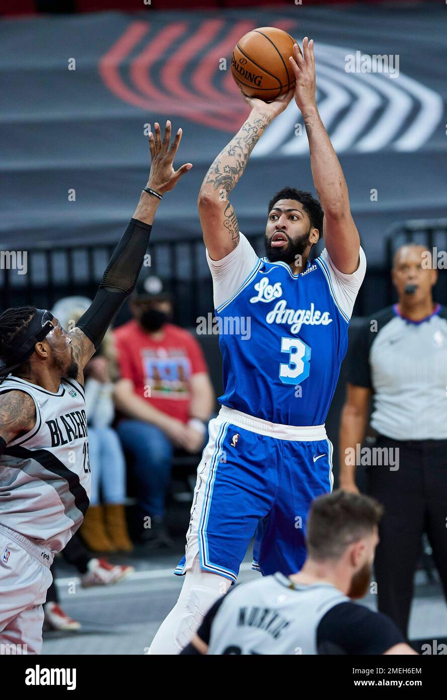 Los Angeles Lakers forward Anthony Davis, right, shoots over Portland