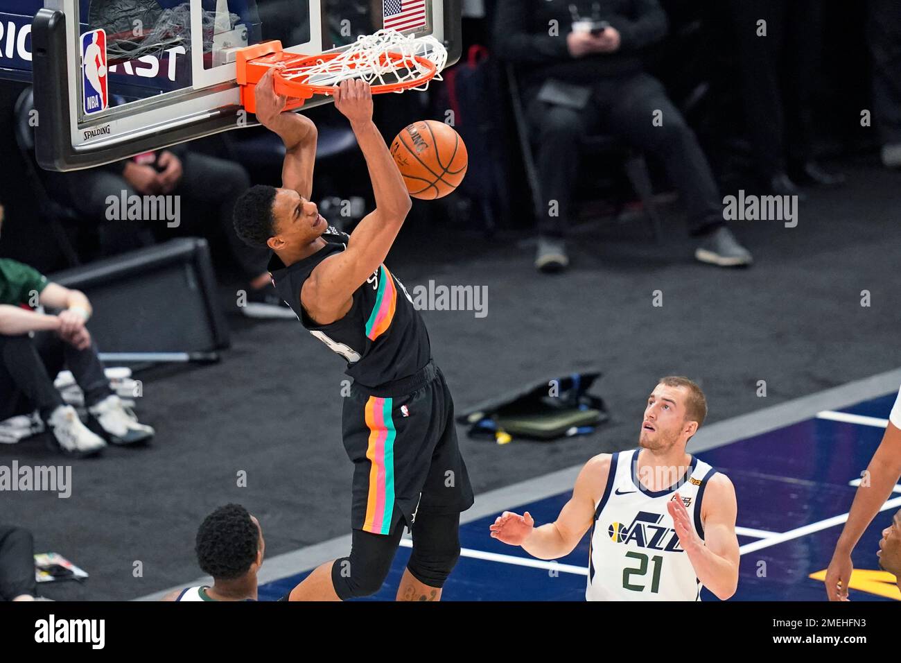 San Antonio Spurs guard Devin Vassell dunks as Utah Jazz guard Matt ...
