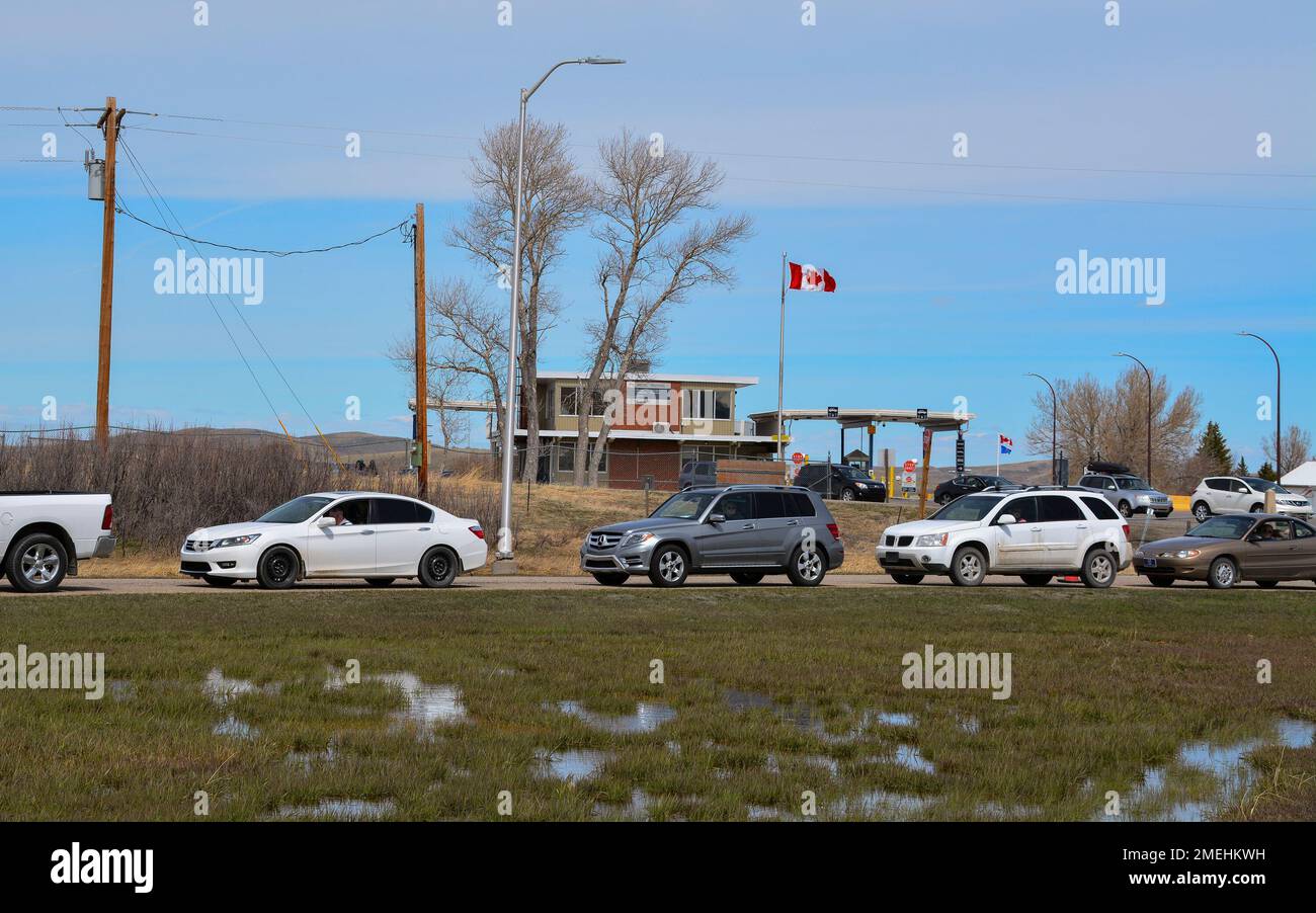 In this Wednesday, April 28, 2021, photo, cars line up at the Piegan