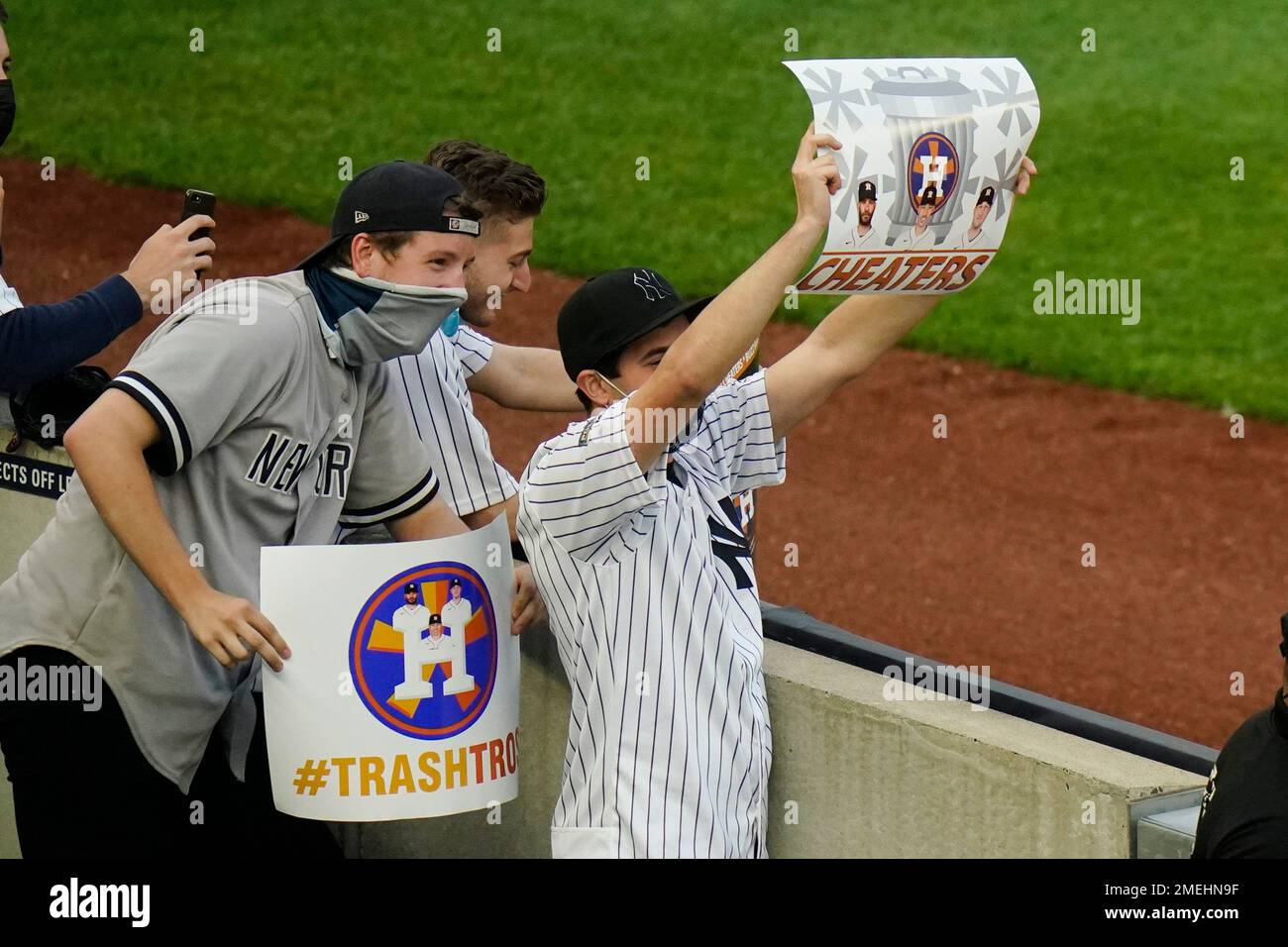 New York Yankees fans hold up signs supporting Yankees manager Joe Torre in  the first inning against the Cleveland Indians during game 3 of the ALDS  against the New York Yankees at