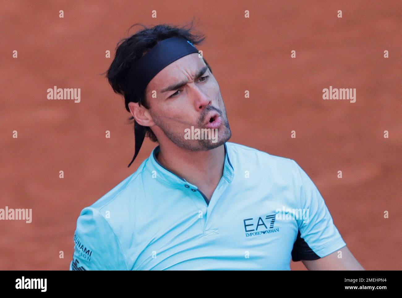 Fabio Fognini of Italy reacts to a fault during his match against Matteo Berrettini of Italy at the Madrid Open tennis tournament in Madrid, Spain, Tuesday, May 4, 2021
